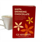 maya drinking chocolate with mug in background