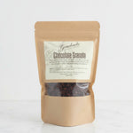 Gearharts Fine Chocolates handcrafted chocolate granola in a stand-up pouch with cacao nibs, almonds, and cranberries.