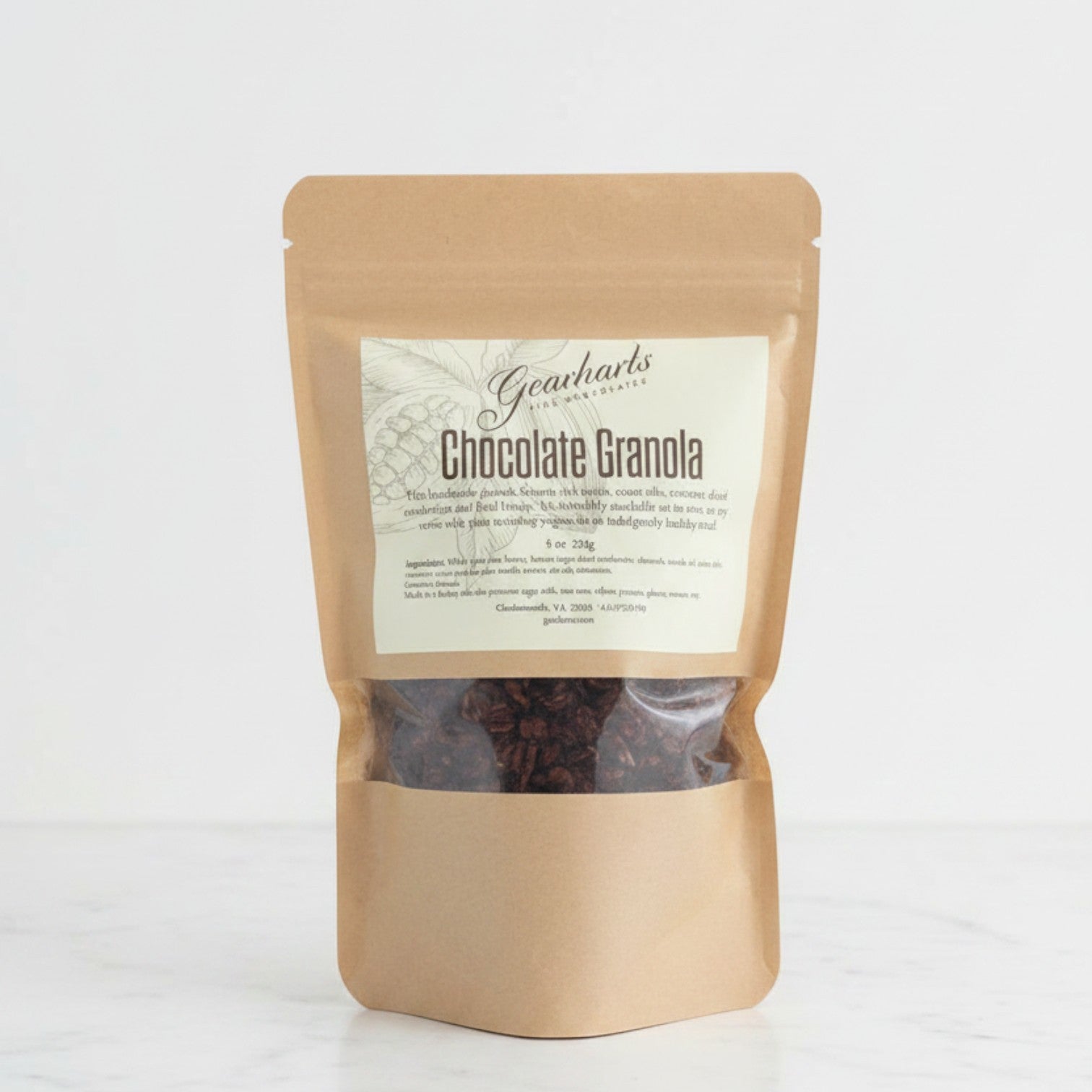 Gearharts Fine Chocolates handcrafted chocolate granola in a stand-up pouch with cacao nibs, almonds, and cranberries.